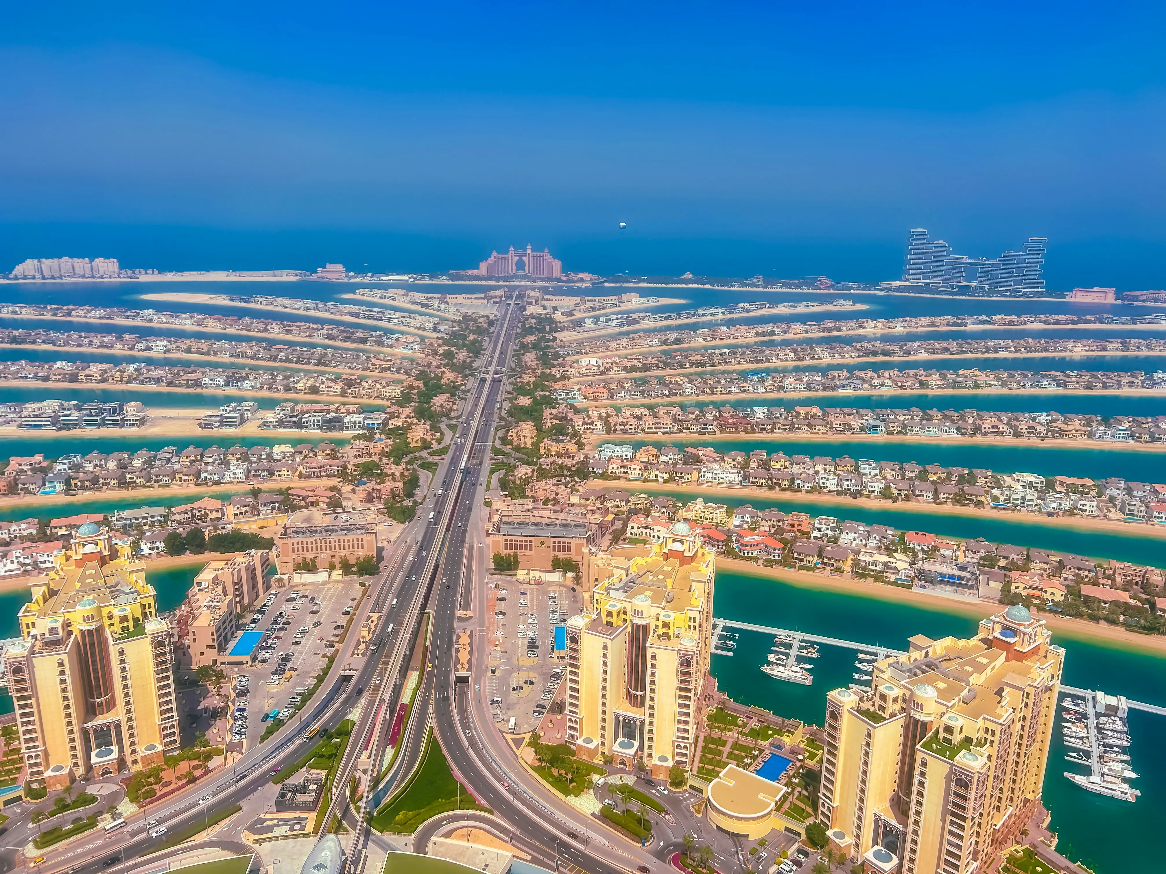Aerial view of Palm Jumeirah in Dubai with luxury beachfront resorts and waterfront villas