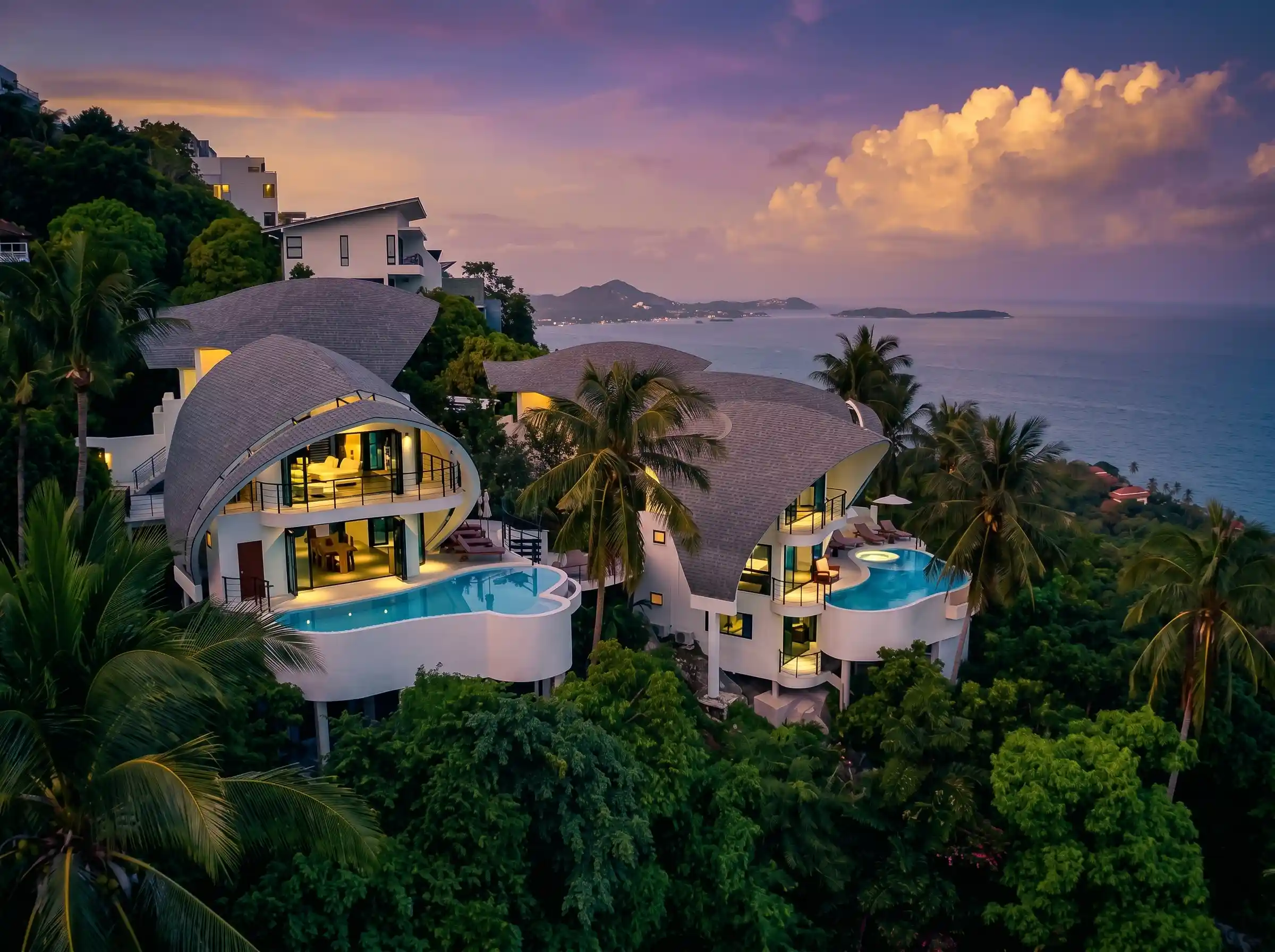 Ultra-luxury private oceanfront villa retreat with infinity pool at sunset